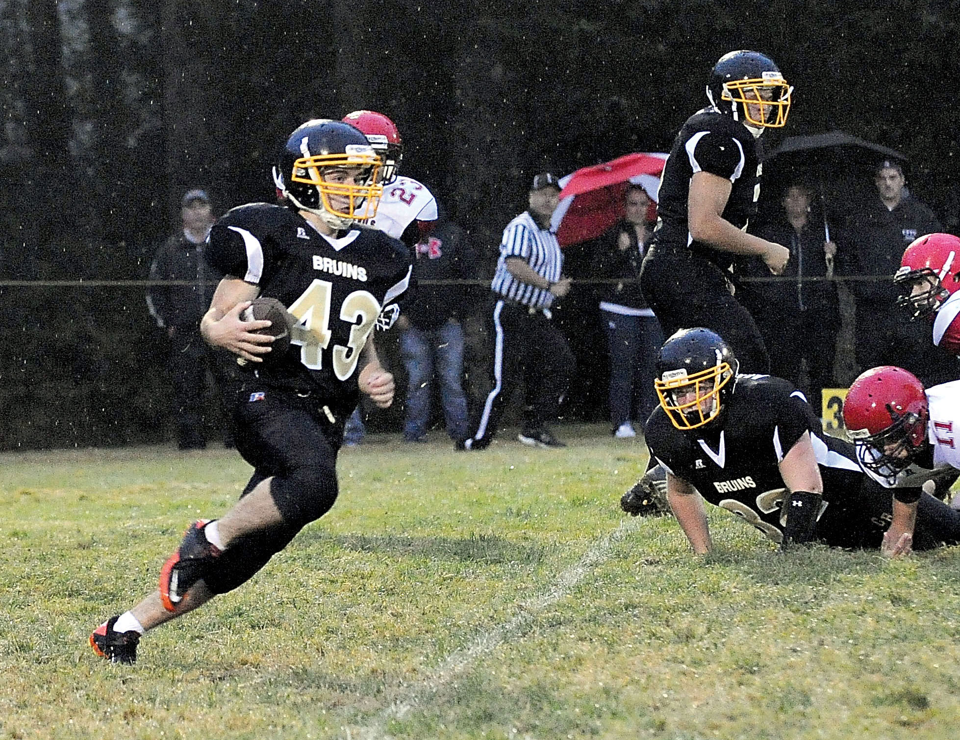 Clallam Bay running back Casey Randall (43) runs upfield against Neah Bay last season. The Bruins will count on Randall's big-play ability this season. Lonnie Archibald/for Peninsula Daily News