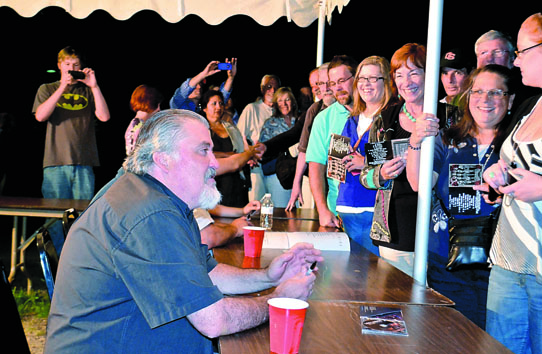 David Hidalgo of Los Lobos signs autographs for fans who attended the show Sunday night at McCurdy Pavilion. Charlie Bermant/Peninsula Daily News