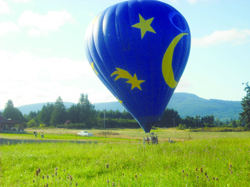 The Luna II balloon touches down in a farmer's field in Sequim on Monday. Margaret McKenzie/Peninsula Daily News
