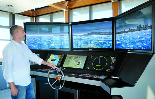 Port Townsend Maritime Center Executive Director Jake Beattie rides a simulated ferry through a storm using the new Pilot House