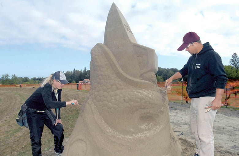 Sand sculptors Lisa Donze of Olympia