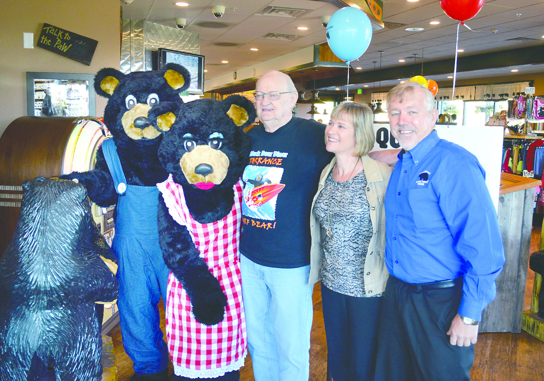 Dick Waterman celebrates the end of his quest to dine at every Black Bear Diner in America with the franchise's bear mascots and Sequim Black Bear owners Trisha and Brett Wirta Tuesday morning. Joe Smillie/Peninsula Daily News