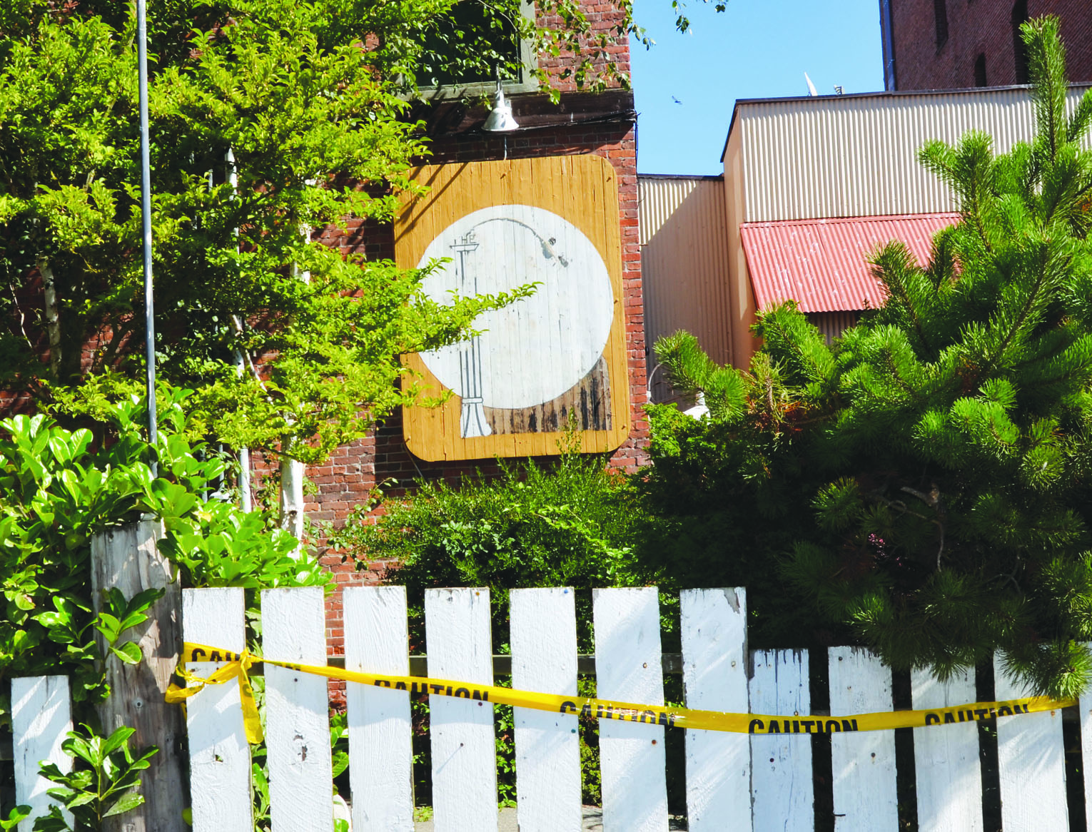 Caution tape and whited-out sign adorn the exterior of the Upstage in Port Townsend these days. Charlie Bermant/Peninsula Daily News
