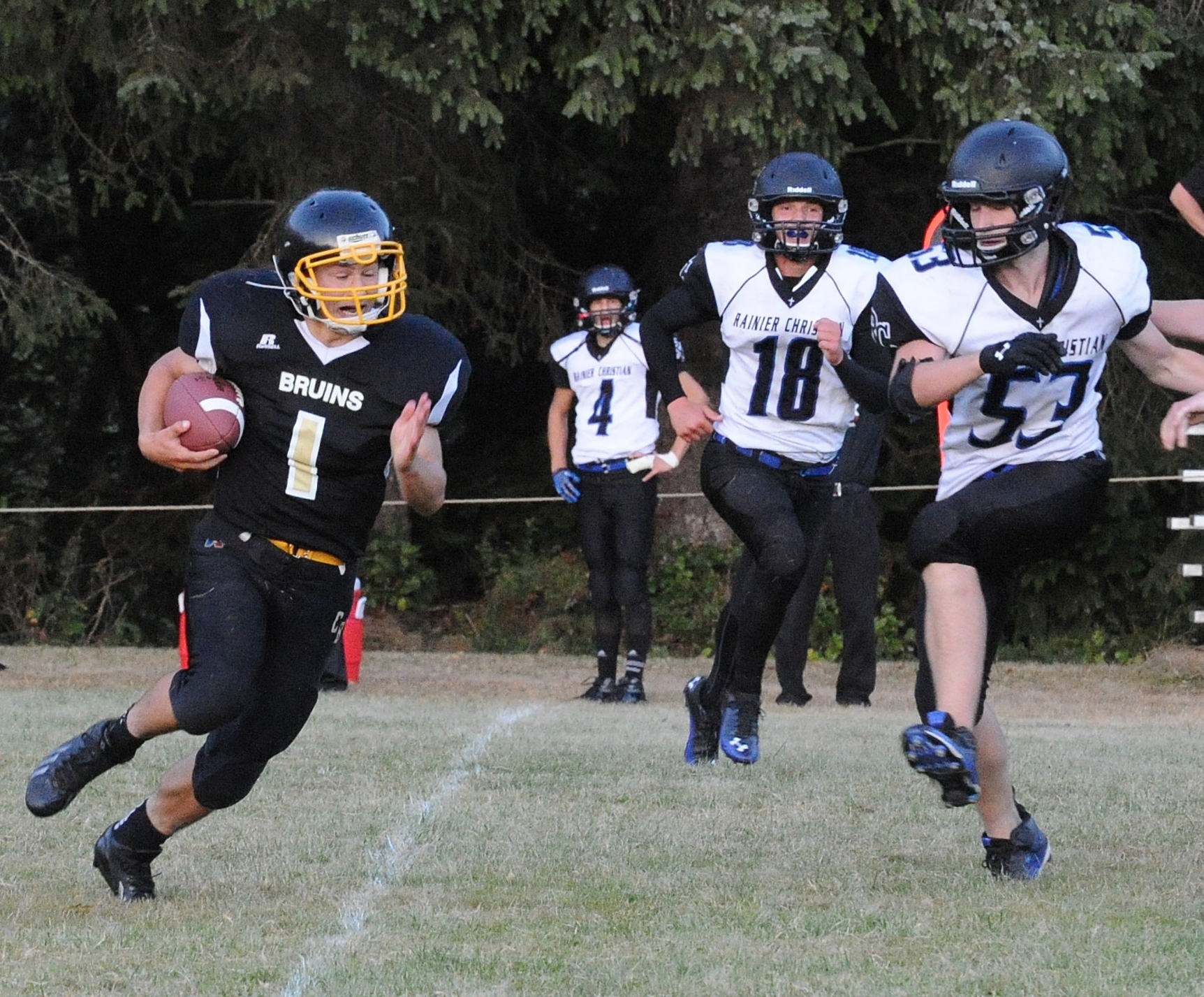 Clallam Bay defensive back Clayton Willis (1) returns an interception 52 yards for a touchdown in the Bruins' 56-26 win over Rainier Christian. Lonnie Archibald/for Peninsula Daily News