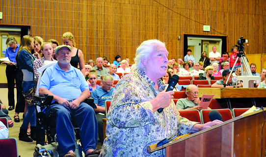 Julie Jamon speaks at the Port Townsend town meeting held Tuesday at the high school. Charlie Bermant/Peninsula Daily News