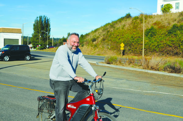 Steve Tucker has replaced his motorcycle and car with an electric bike. Charlie Bermant/Peninsula Daily News