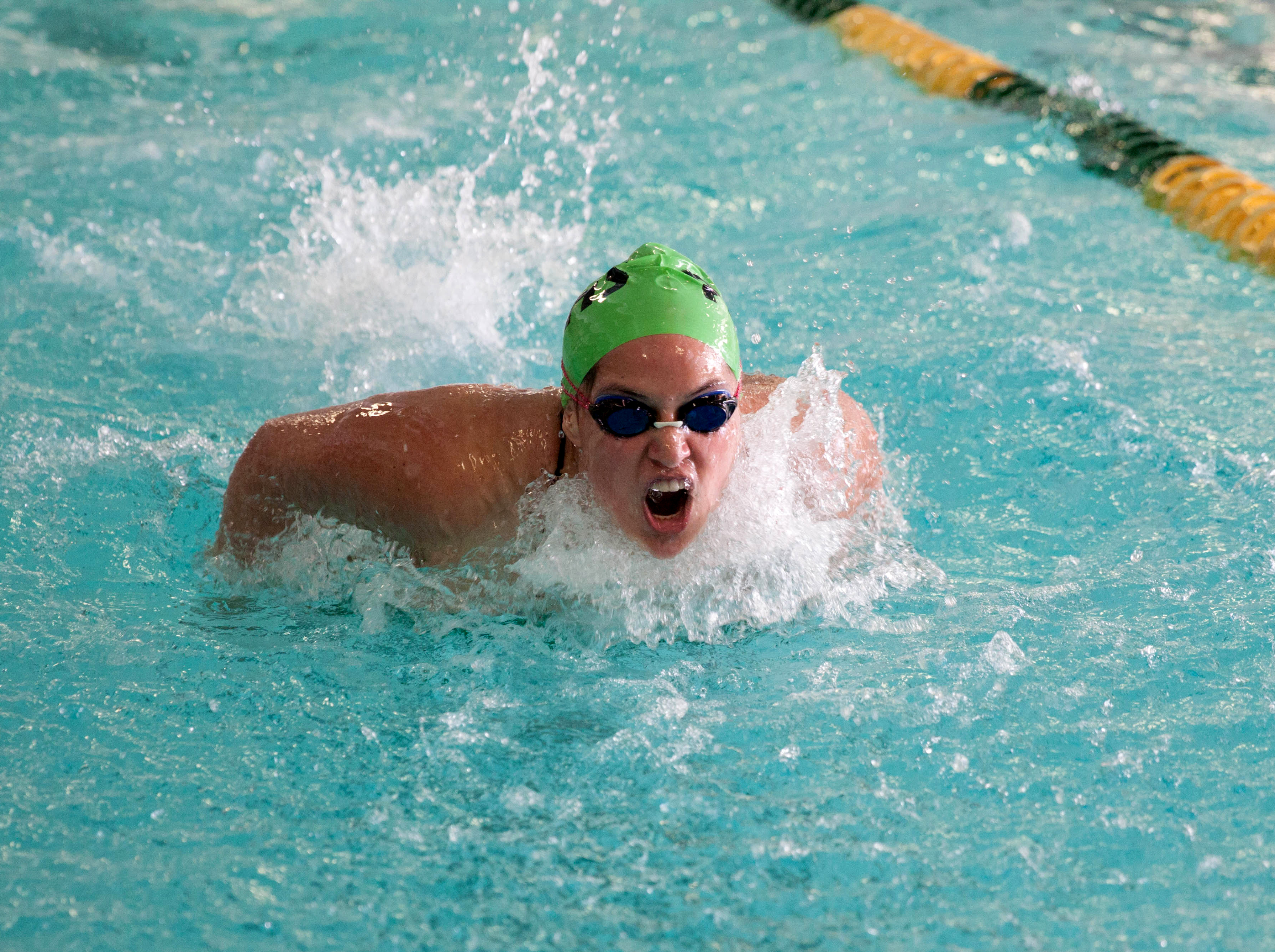 Janie Macias swims the breastroke during the 200 individual medley against Sequim. Macias took first in the event by swimming a state-qualifying time of 2:22.08. Patty Reifenstahl