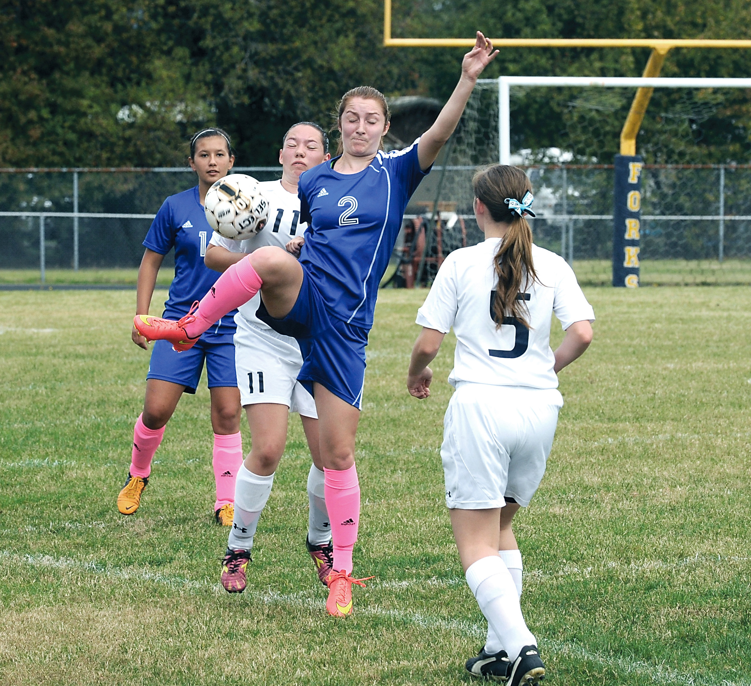 Chimacum's Sammy Rains (2) and Forks' Rani Banks (11) compete for the ball during the Cowboys' 6-1 win over the Spartans. Also in on the action are Chimacum's Nicole Cerna (14) and Forks' Caitlyn Wells (5). Lonnie Archibald/for Peninsula Daily News