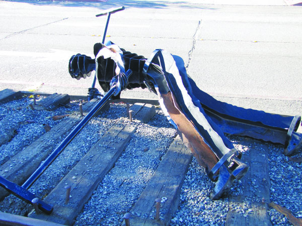 The sculpture "Gandy Dancer" lies on its side