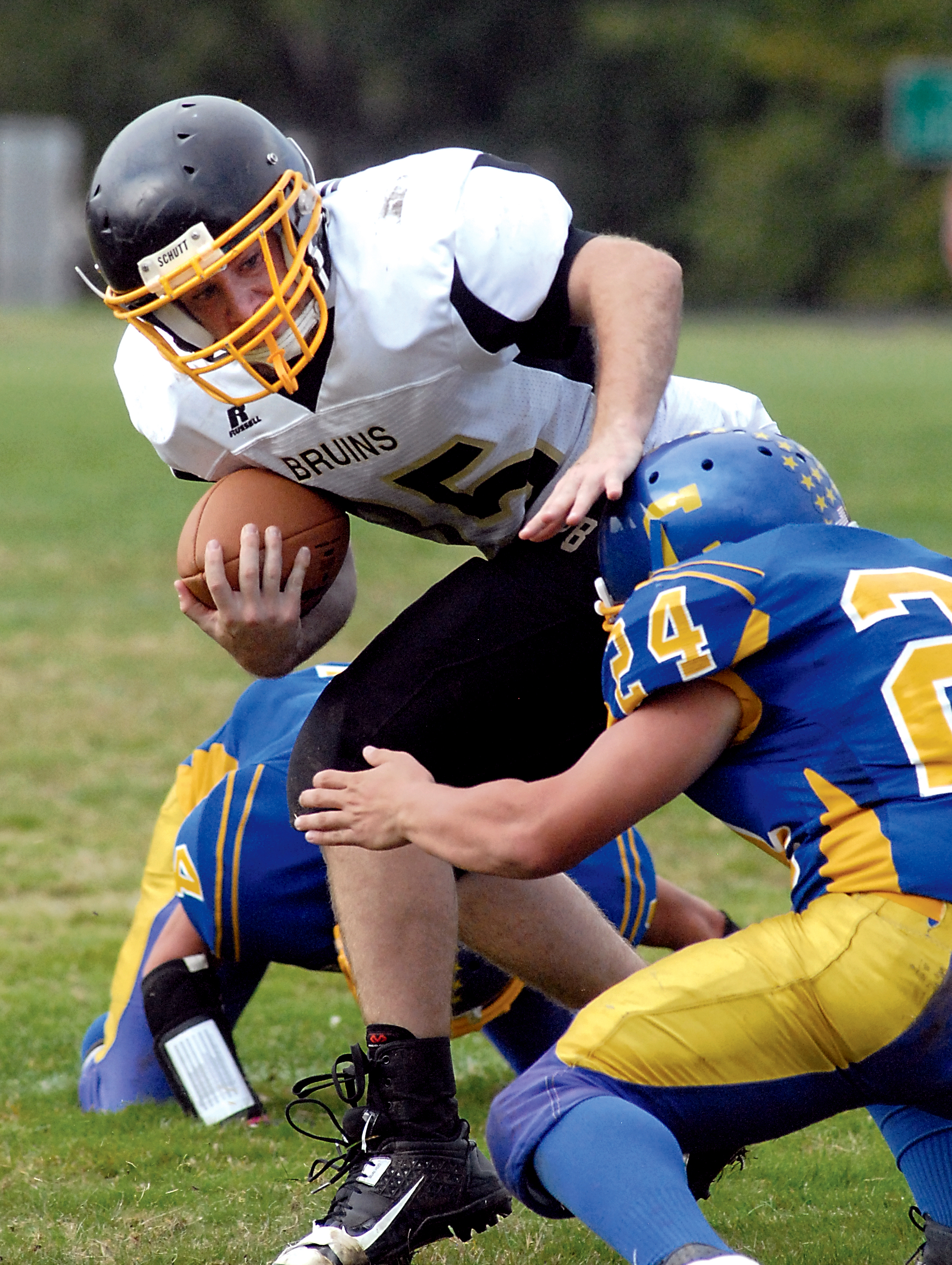 Clallam Bay's Kyle Keys fends off the defensive efforts of Crescent's Luke Leonard