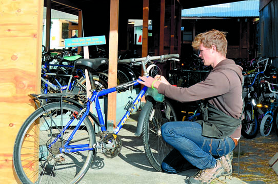 Chuancey Tudhope-Locklear works on a bicycle at ReCyclery Port Townsend. Charlie Bermant/Peninsula Daily News