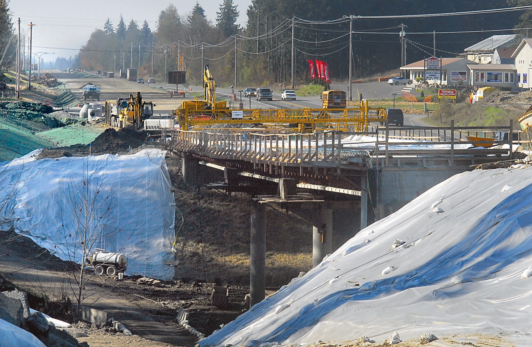 Traffic passes by a new bridge being built over McDonald Creek as part of a project to complete U.S. 101 as a four-lane highway between Port Angeles and Sequim. -- Photo by Keith Thorpe/Peninsula Daily News