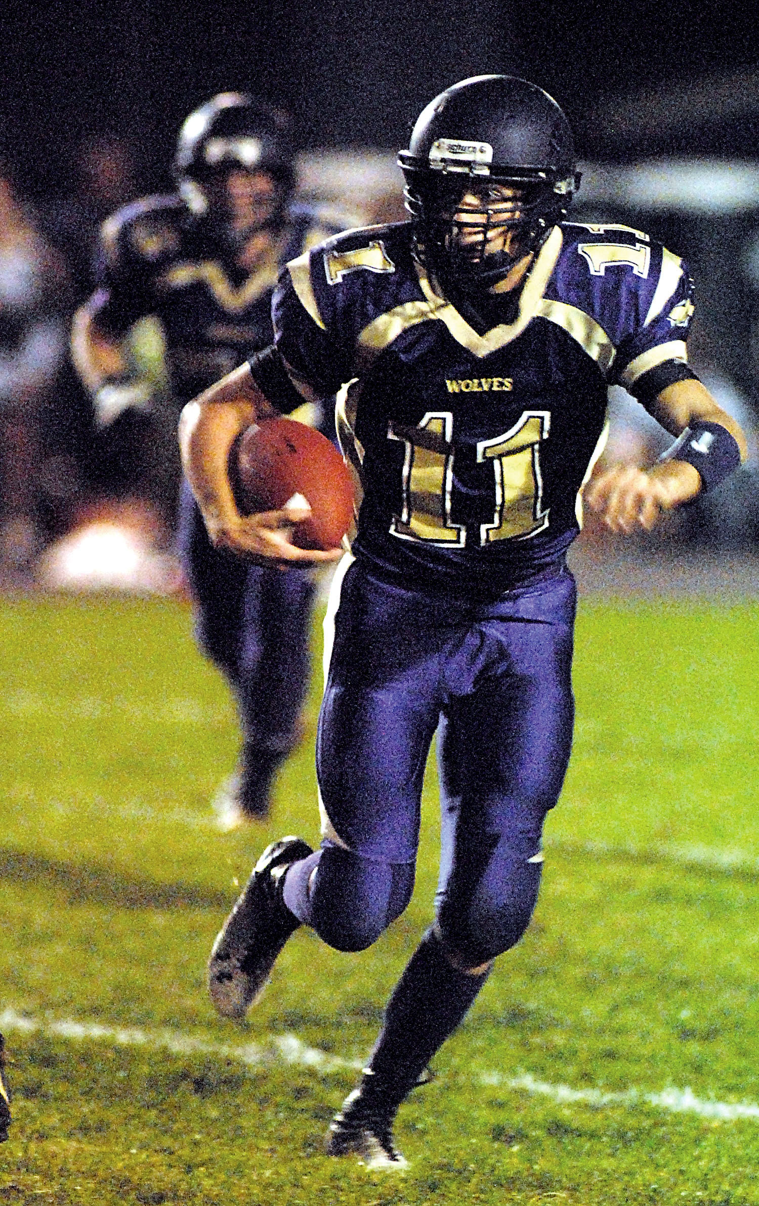Sequim wide receiver Noah Christiansen gains yardage in the Wolves' win against Port Angeles. Keith Thorpe/Peninsula Daily News