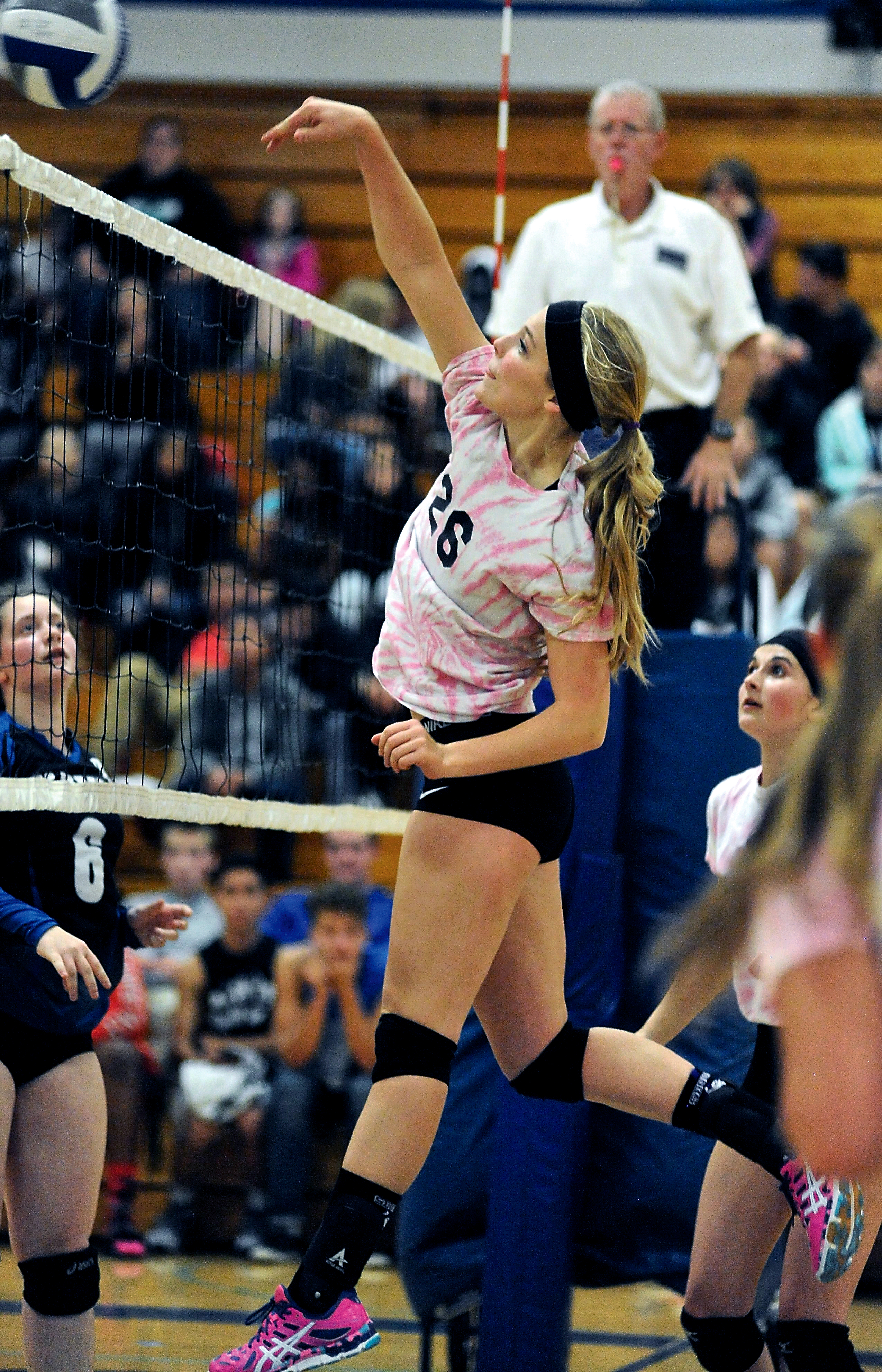 Sequim's Ella Christiansen returns the ball during the Wolves' 3-0 sweep of the Olympic Trojans in Bremerton on Tuesday. Jeff Halstead/for Peninsula Daily News