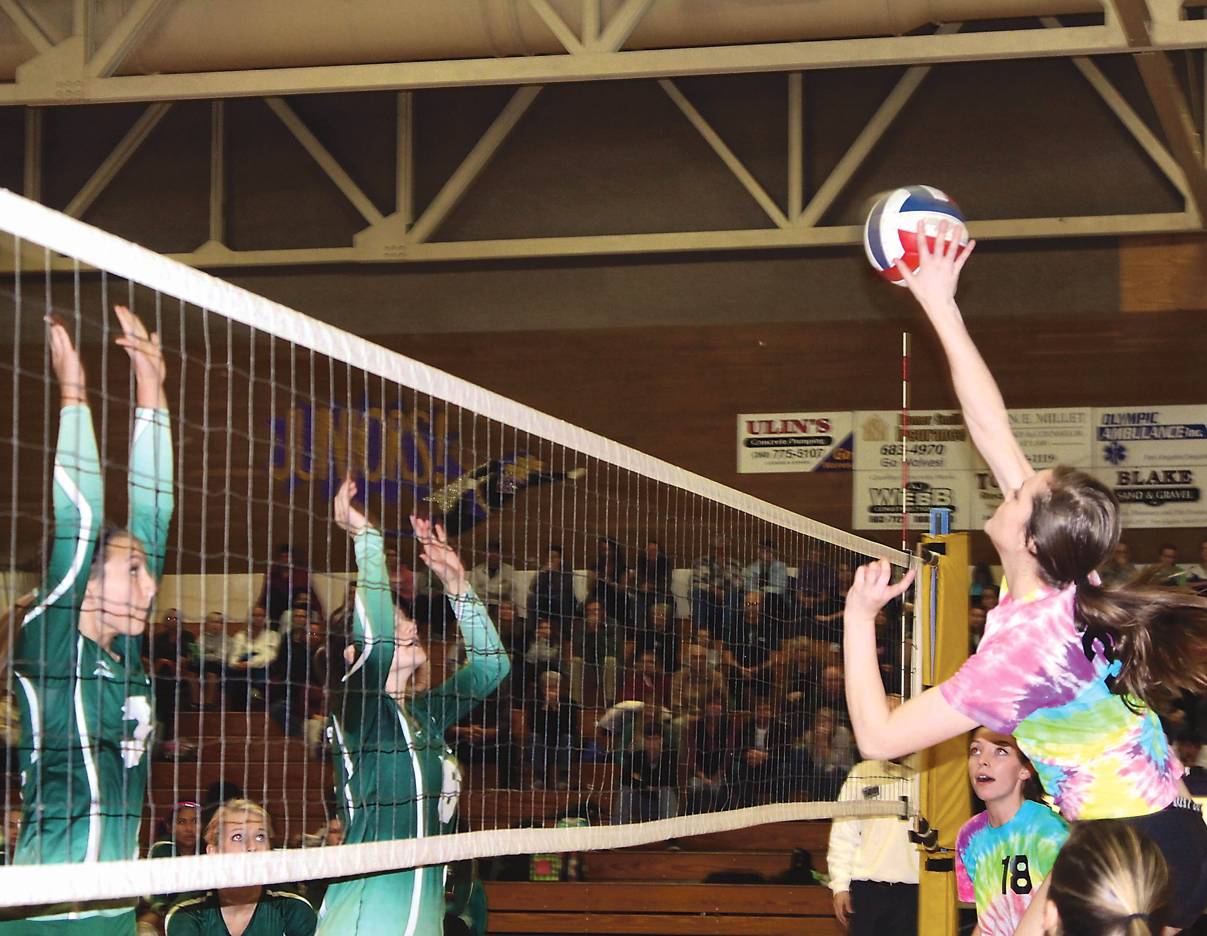 Port Angeles' Emily Johnson (3) and Genna Orr (6) await from Sequim's Alyse Armstrong (30)