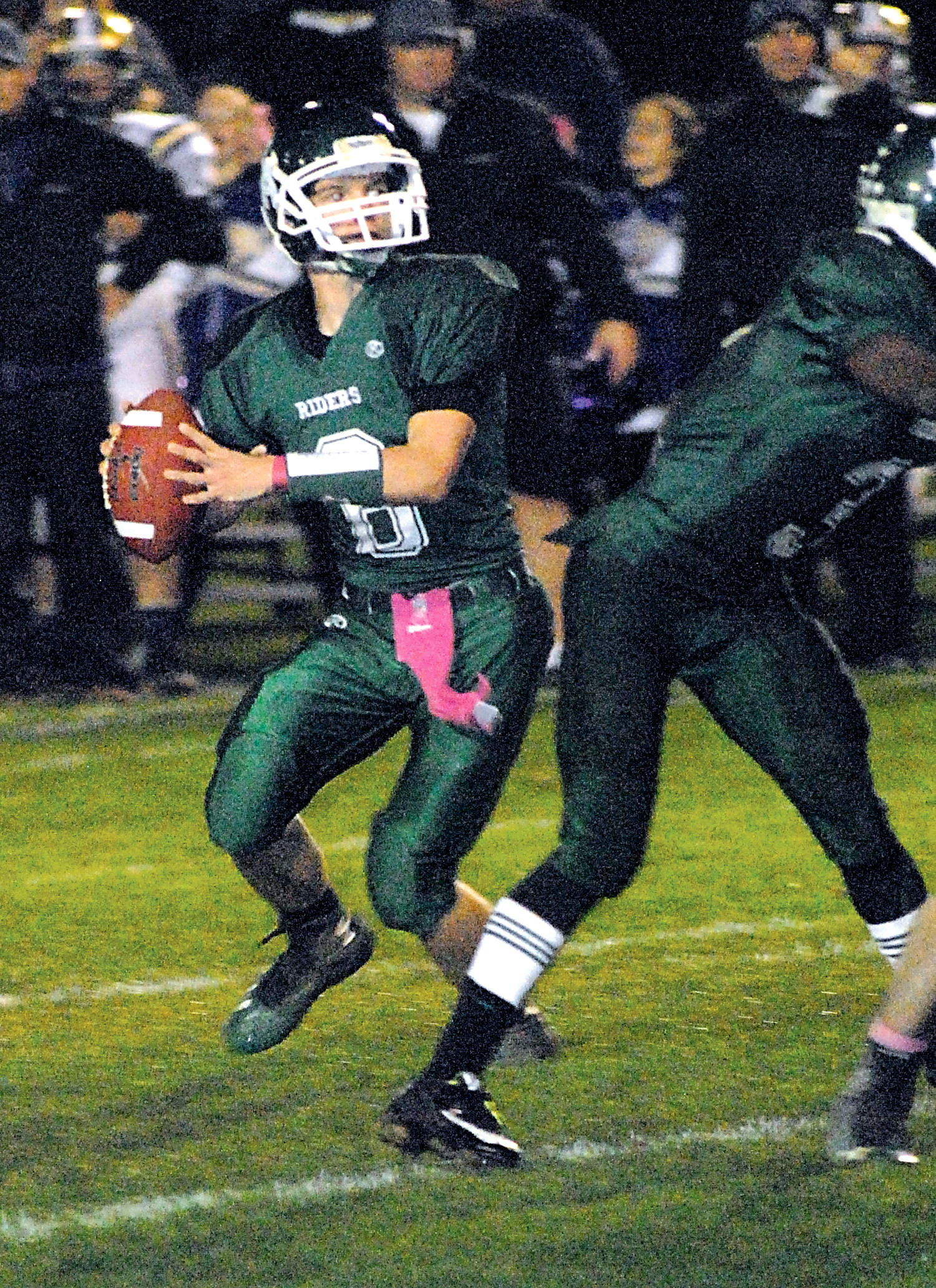 Port Angeles quarterback Ryan Rodocker drops back to pass during last week's game against North Kitsap at Civic Field. The Roughriders play Kingston tonight with a postseason berth on the line. Keith Thorpe/Peninsula Daily News