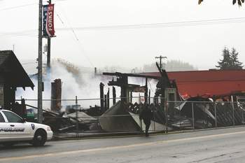 Burned rubble is shown earlier this week in Forks of the old IOOF hall (used as a community arts center) and an adjacent store building that once housed the Dazzled by Twilight store. Lonnie Archibald/for Peninsula Daily News