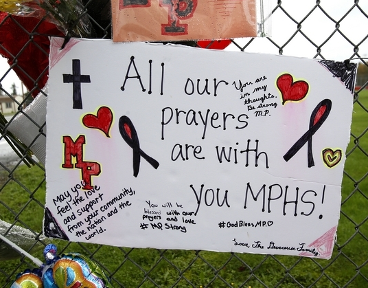 Handwritten thoughts and prayers by Marysville Pilchuck students and others are scattered end to end along the memorial fence at the south edge of campus. The (Everett) Herald