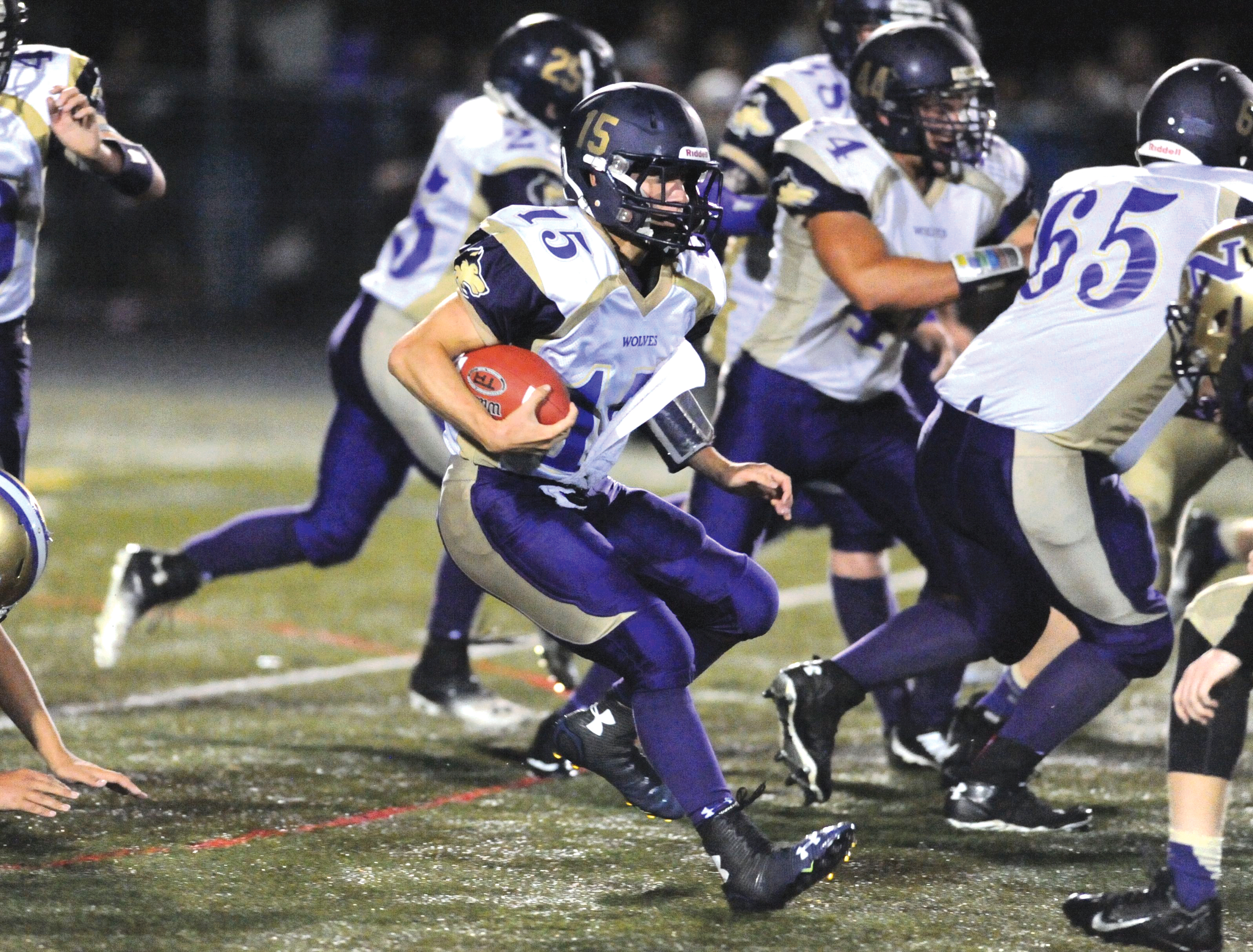 Sequim quarterback Miguel Moroles runs upfield against North Kitsap earlier this season. Jeff Halstead/for Peninsula Daily News