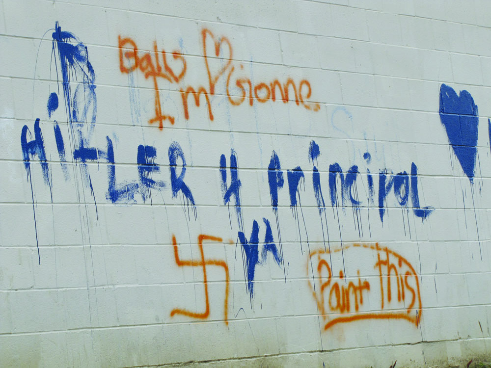 Port Angeles police believe middle-schoolers are behind this graffiti on the back wall of the gym at Stevens Middle School. Arwyn Rice\/Peninsula Daily News