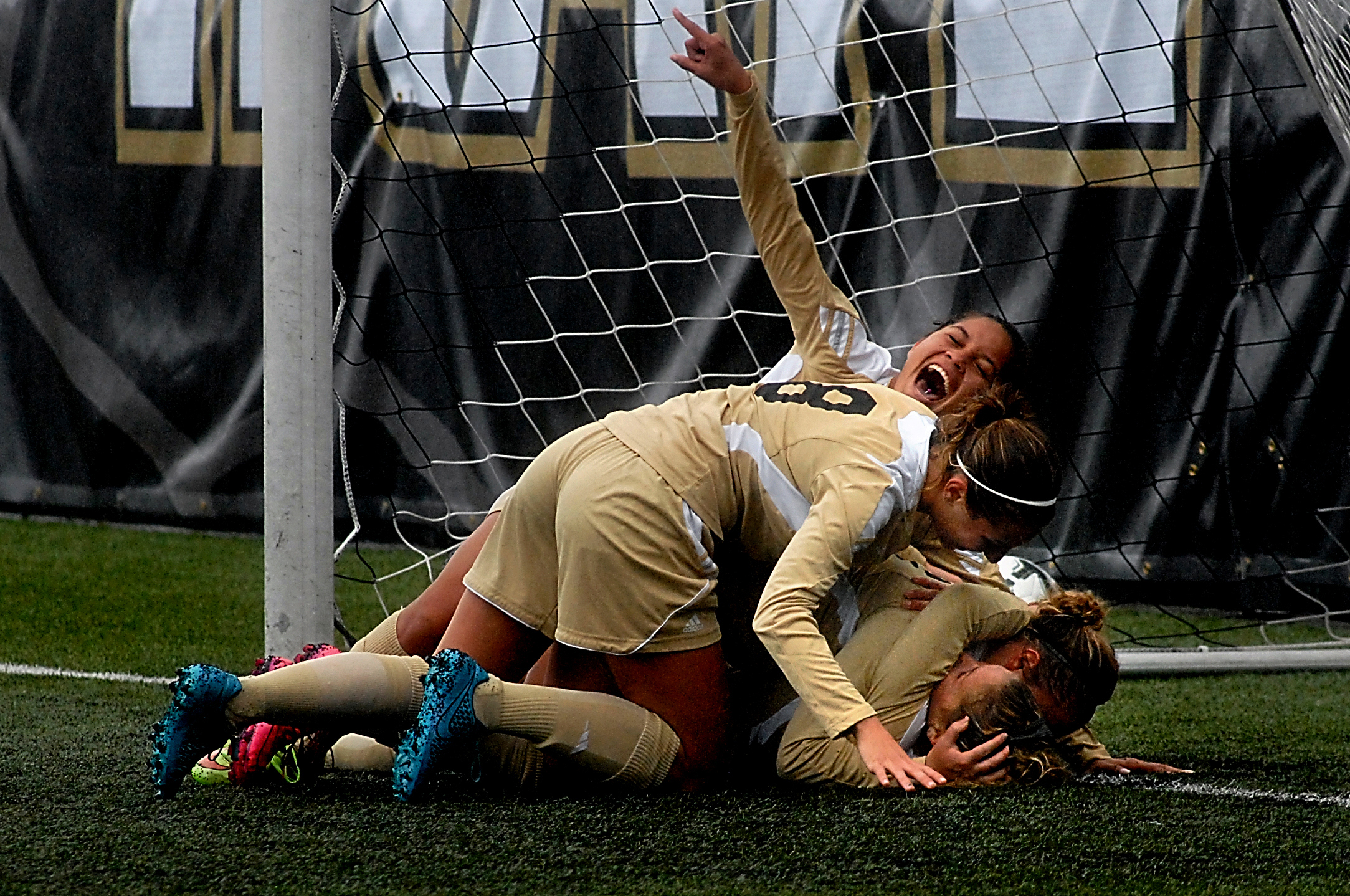 Teammates pile up on Ellie Small after she scored the winning goal for the Peninsula Pirates in the second overtime period against North Idaho in the NWAC quarterfinal game in Port Angeles. Joining in the dogpile were Michele Whan