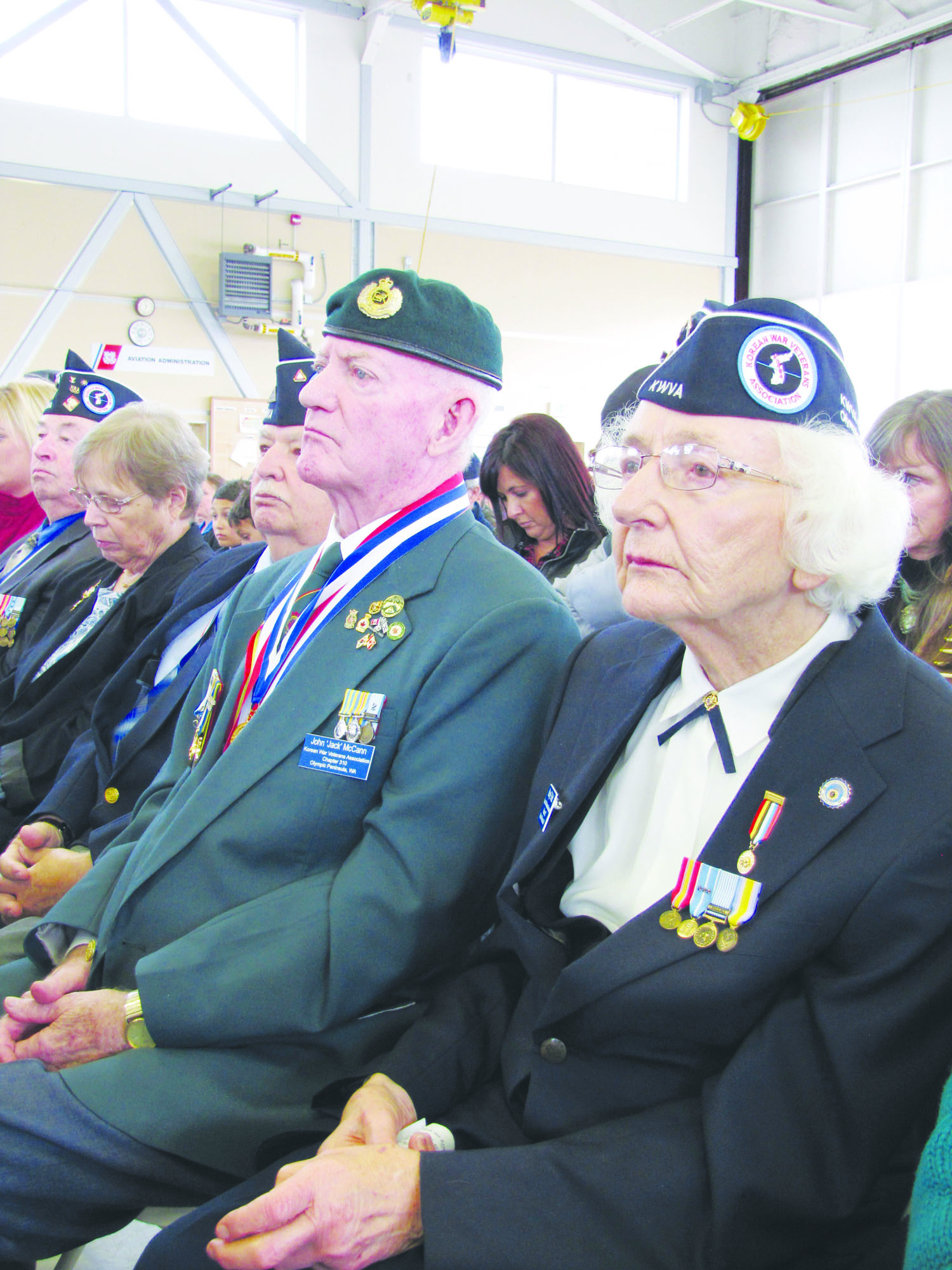 Korean War vets John "Jack" McCann and Mary Reid attend Sunday's ceremony honoring veterans at the Coast Guard Air Station/Sector Field Office Port Angeles. Arwyn Rice/Peninsula Daily News