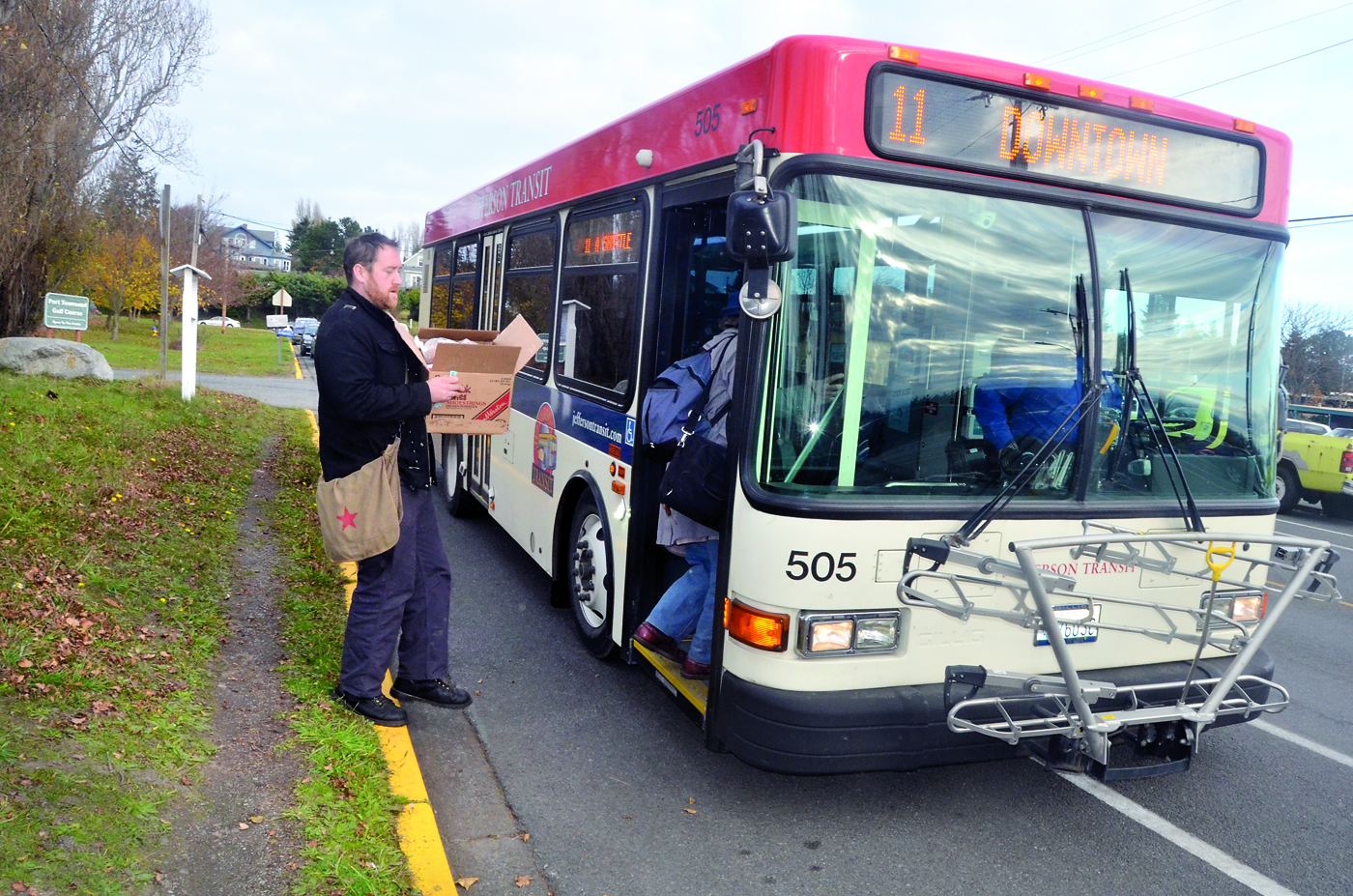 John Cain boards the bus in front of the Port Townsend Food Bank on Wednesday. A routing change instituted new stops in order to give clients without cars easier access to the food bank.  -- Photo by Charlie Bermant/Peninsula Daily News