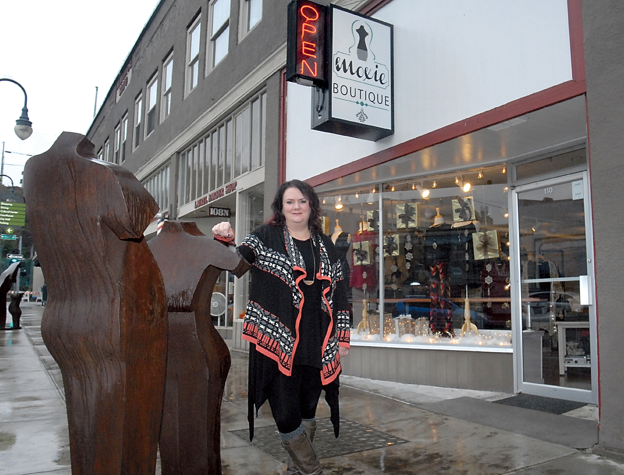 Moxie Boutique owner Sanda Hart says she takes her store refuse to the alley behind her Laurel Street store rather than have an employee do it because she has seen drug activity in the alley. —Photo by Keith Thorpe/Peninsula Daily News