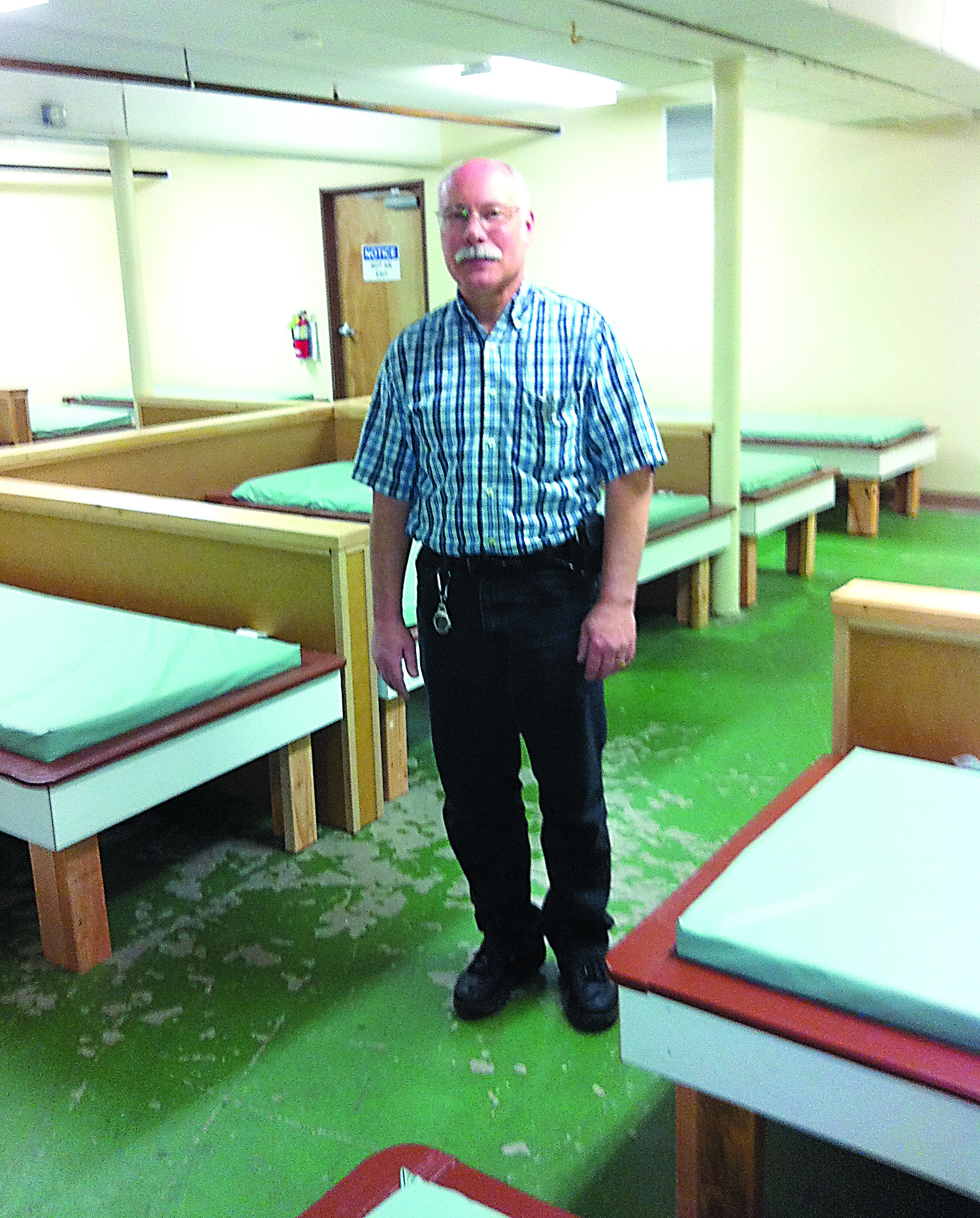 COAST co-chair Carl Hanson in the winter shelter with some of the 23 newly constructed bunks. -- Photo by Charlie Bermant/Peninsula Daily News