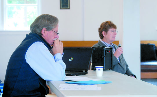Public Health Officer Tom Locke listens as Eeveleen Muehlethaler