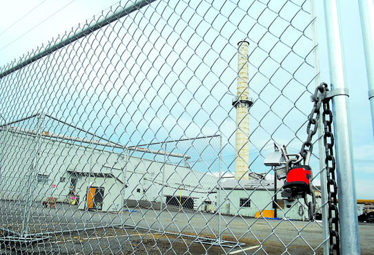A new security fence surrounds the former Peninsula Plywood site in Port Angeles. A webcam will allow people to view the demolition online. Keith Thorpe/Peninsula Daily News