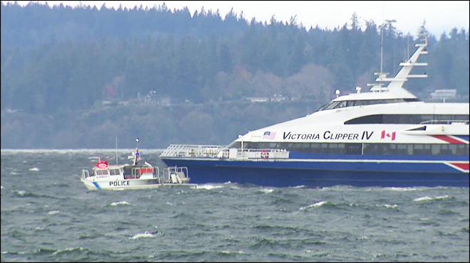 Police board the Victoria Clipper IV in Elliott Bay on Sunday morning.  —Photo from KOMO News