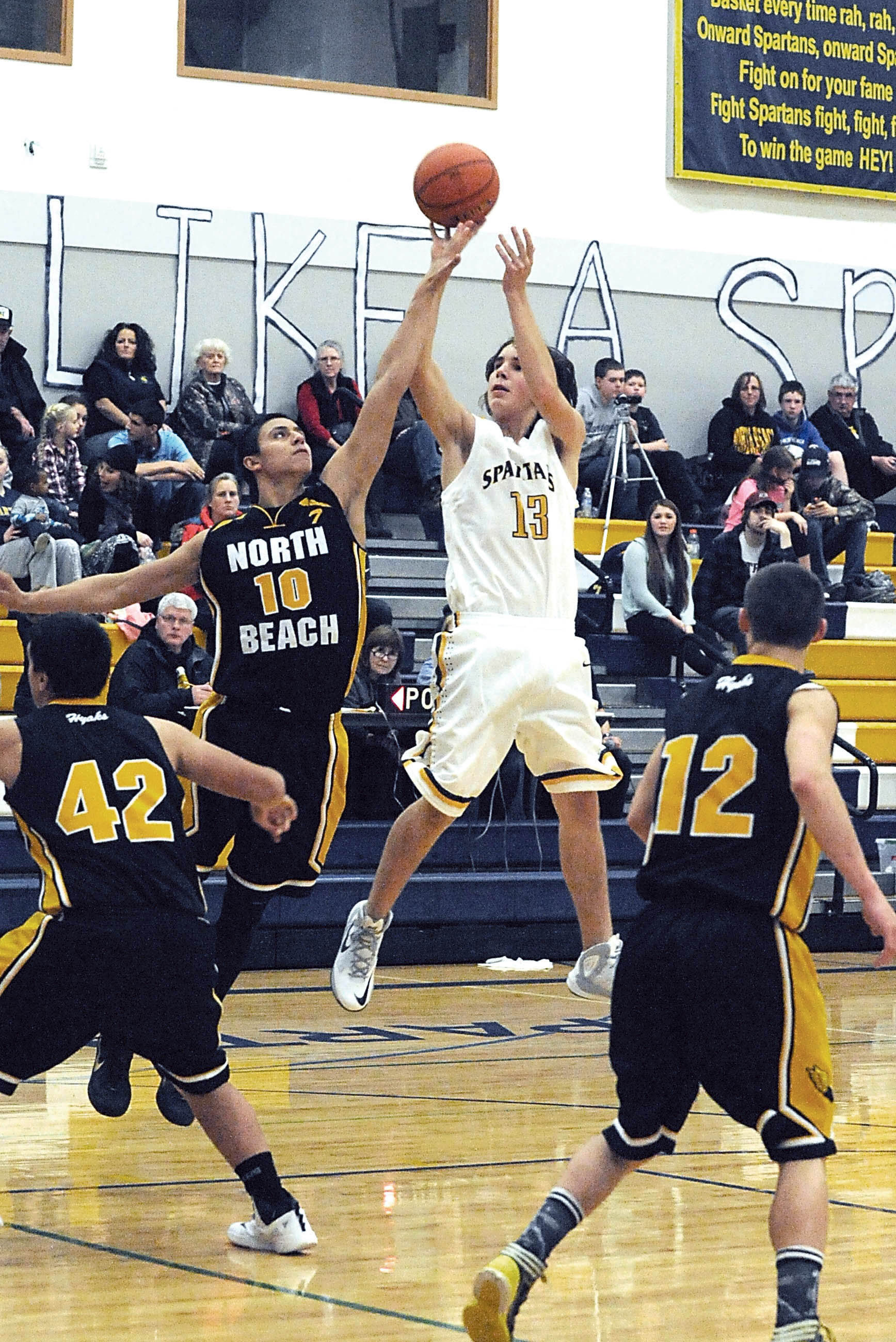 Forks' Billy Palmer (13) puts up a shot during the Spartans' season-opening loss to North Beach Lonnie Archibald/for Peninsula Daily News