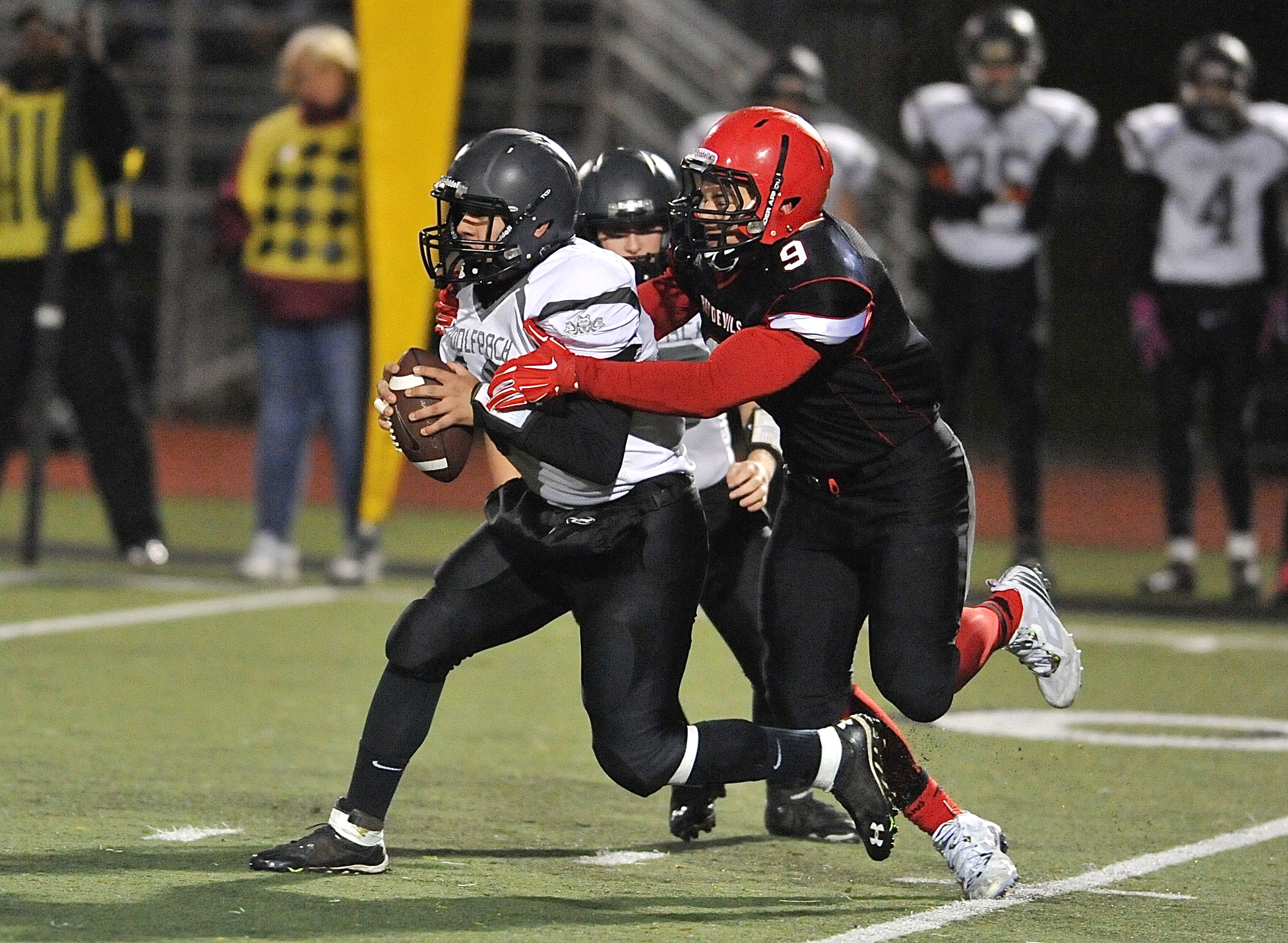 Neah Bay defensive end John Reamer sacks Twin Valley quarterback Kobe Kalama during the state quarterfinals. Reamer was voted to the All-Northwest Football League first team offense and defense. Jeff Halstead/for Peninsula Daily News