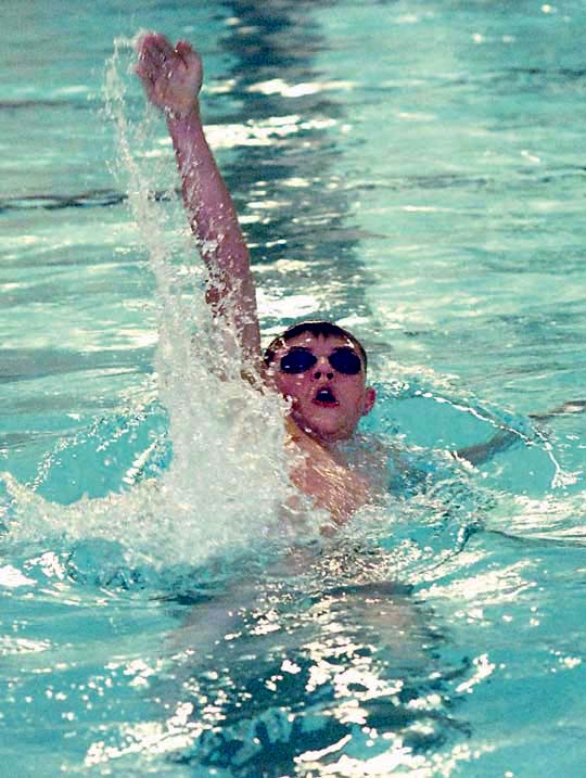Port Angeles' Tristin Butler swims a state time backstroke in the 200 individual medley. Keith Thorpe/Peninsula Daily News