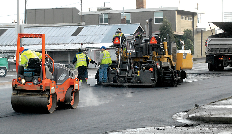 Paving work continued Wednesday at the site of a water main break in Port Angeles. Keith Thorpe/Peninsula Daily News