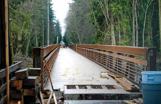 The new 750-foot trestle connecting the Dungeness River Bridge to the western bank of the river is nearly completed and will be open to the public starting Thursday. Chris McDaniel/Peninsula Daily News