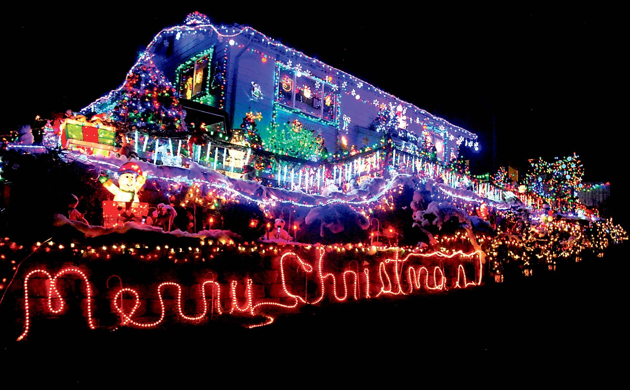 This house in the 700 block of South Chambers Street stands like a beacon of color in the Port Angeles night. Keith Thorpe/Peninsula Daily News