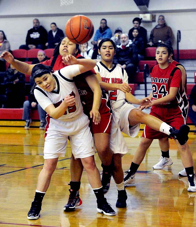 Tulalip Heritage's Adiya Johnson gets sandwiched between Neah Bay's Tristin Johnson
