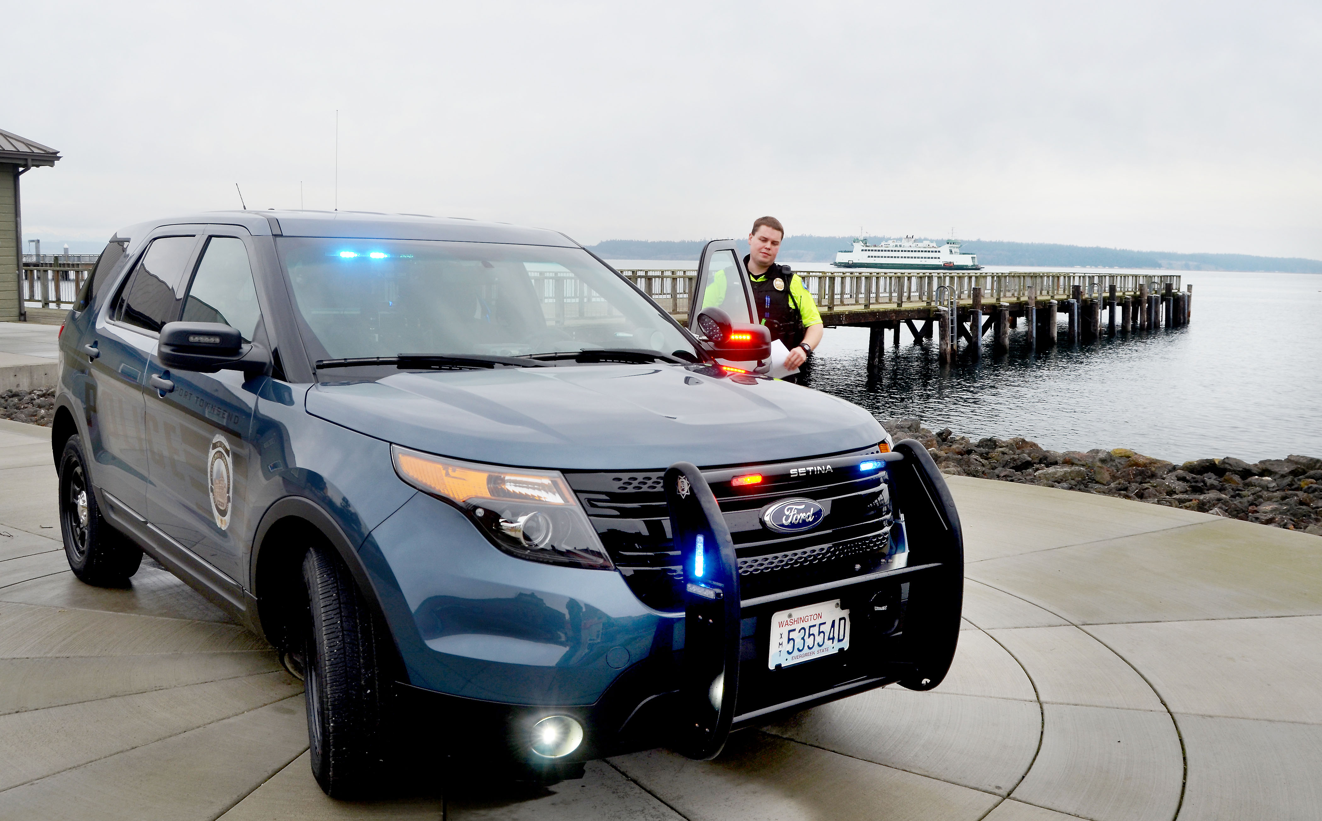 Port Townsend Police Officer Luke Bogues with one of three new Ford Police Interceptors now in service with the city's police department. — Charlie Bermant/Peninsula Daily News