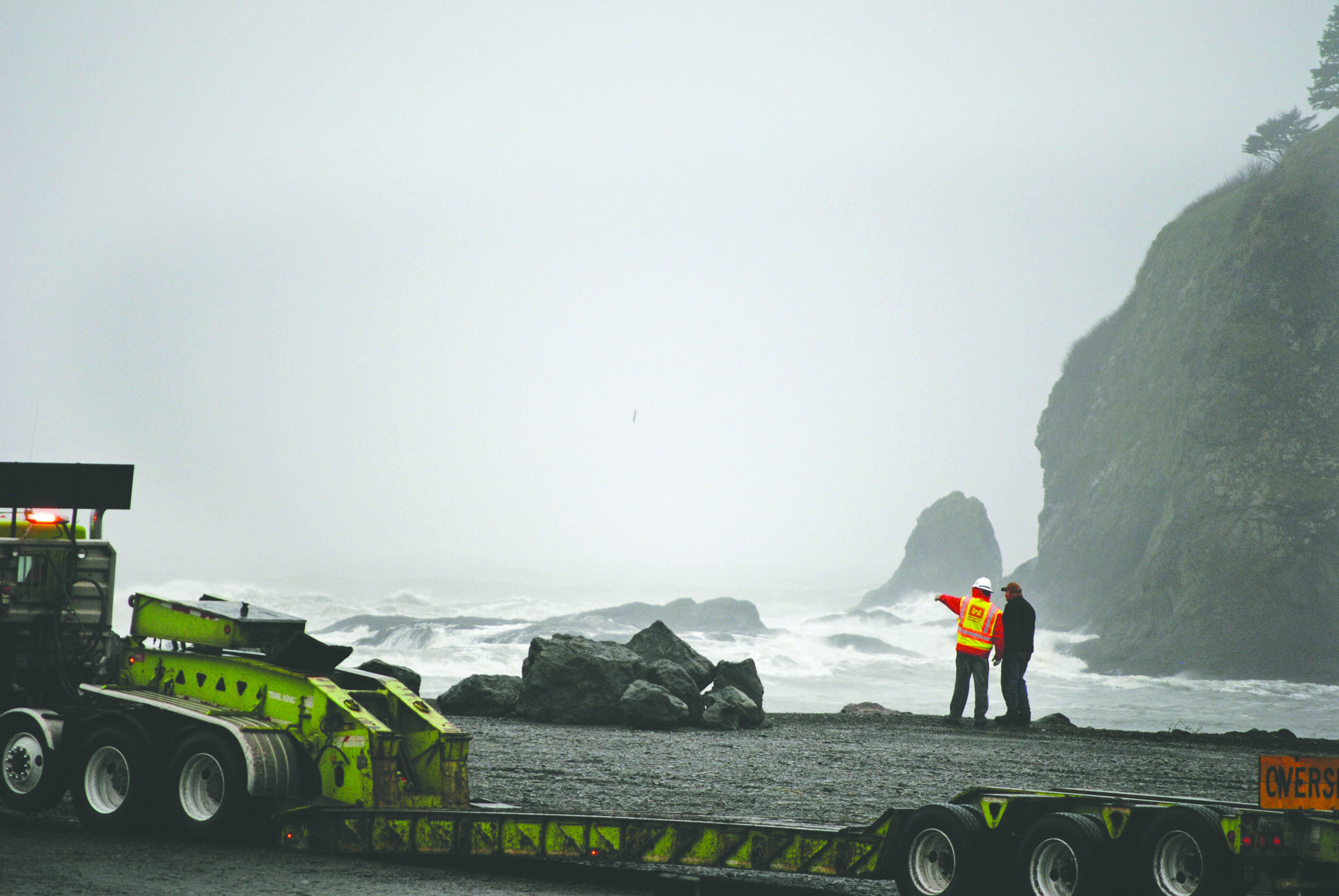 Workers with Bruch and Bruch Construction of Port Angeles and the Army Corps of Engineers scurry to place protective rock called rip rap along the LaPush waterfront Friday. Emily Foster/The Talking Raven