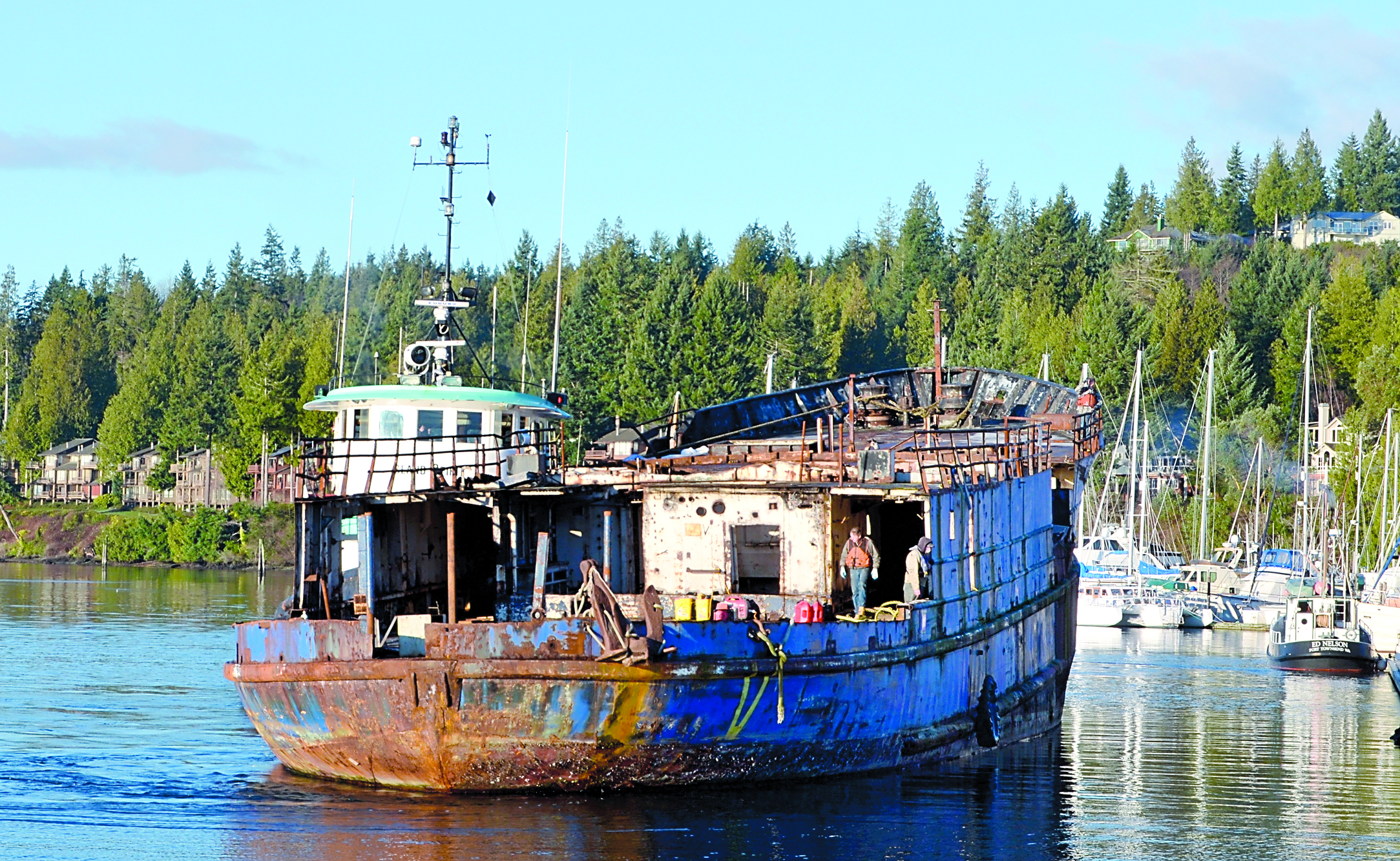 The engineless New Star is towed out of Port Ludlow under the auspices of the state Department of Natural Resources