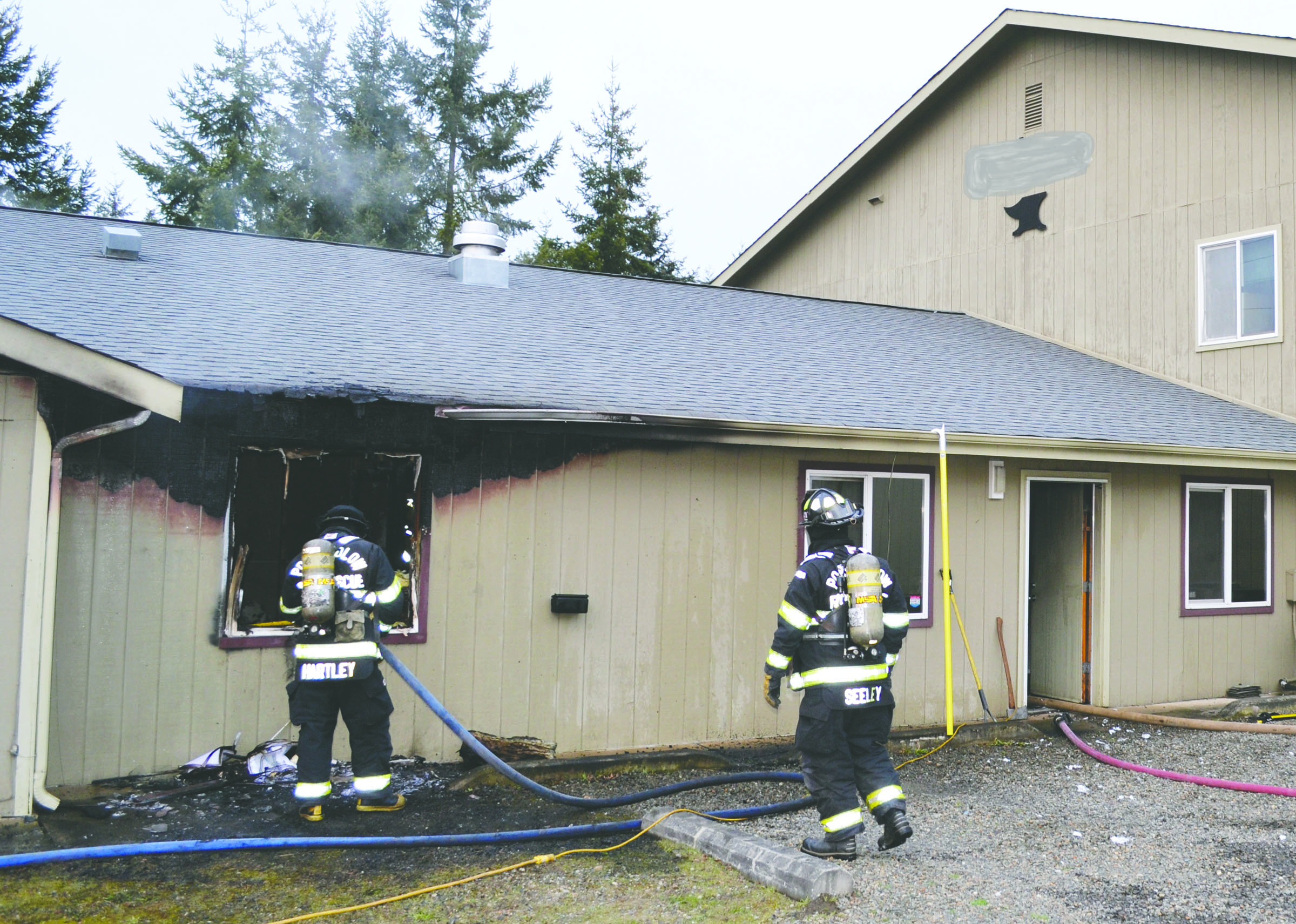 Firefighters from Port Ludlow Fire and Rescue battle a blaze in an office on Colwell Street in Port Hadlock on Saturday. They were assisted by East Jefferson Fire-Rescue and Naval Magazine Indian Island firefighters. — Bill Beezely/East Jefferson Fire-Rescue