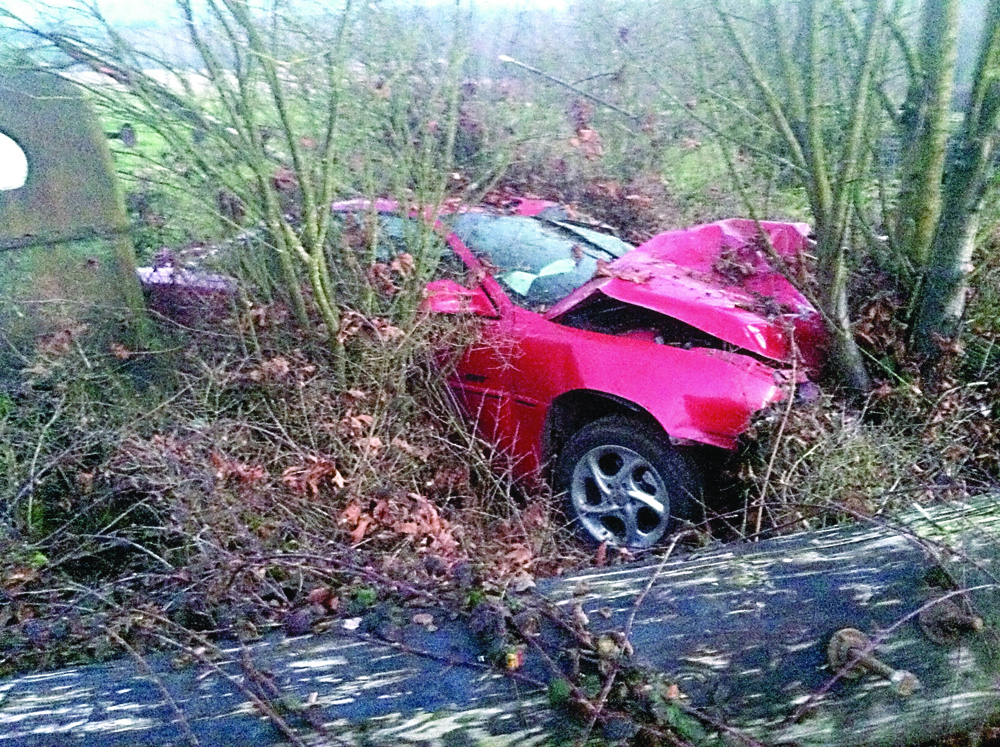 Clallam County Fire District No. 2 responds to a single-car accident Monday on state Highway 112. Clallam County Fire District No. 2