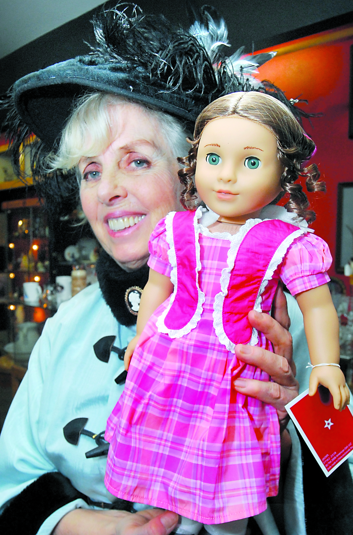 Barbara Lott of Port Angeles displays the grand-prize doll that will be awarded by drawing at this weekend's “Promise of Spring” doll show at Vern Burton Community Center in Port Angeles. Keith Thorpe/Peninsula Daily News