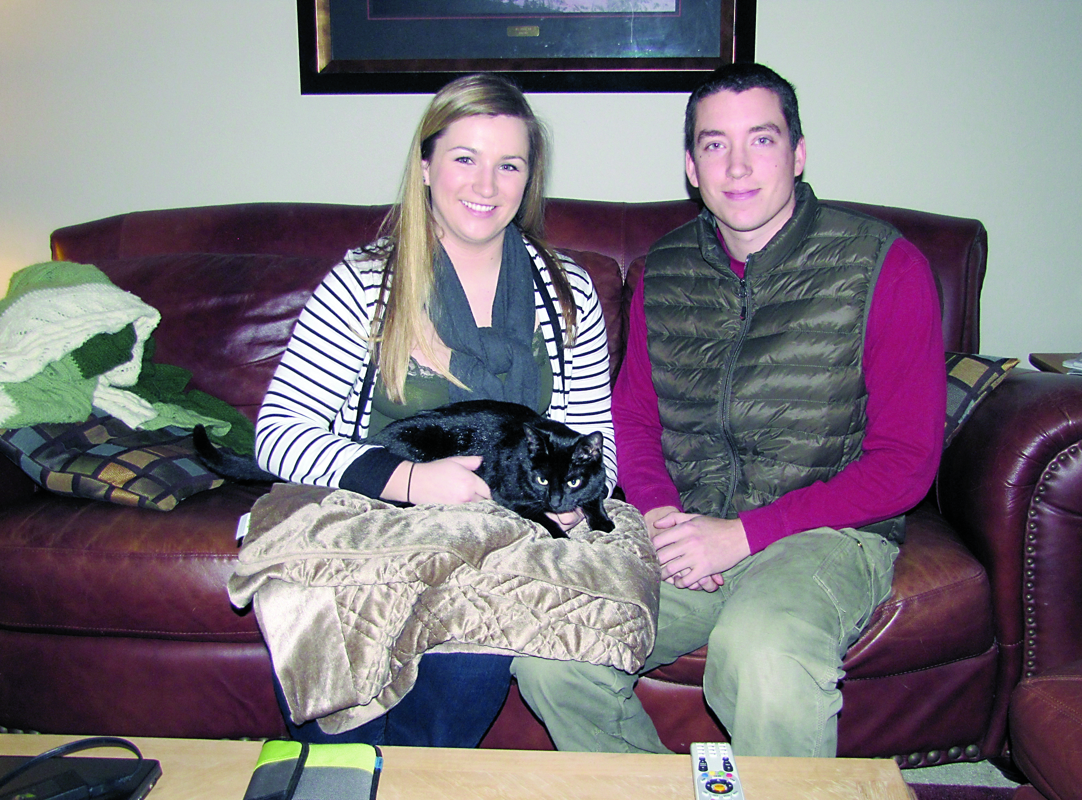Port Angeles residents Katharine and Tyler Bieker welcomed their cat Max home 15 months after it disappeared.
