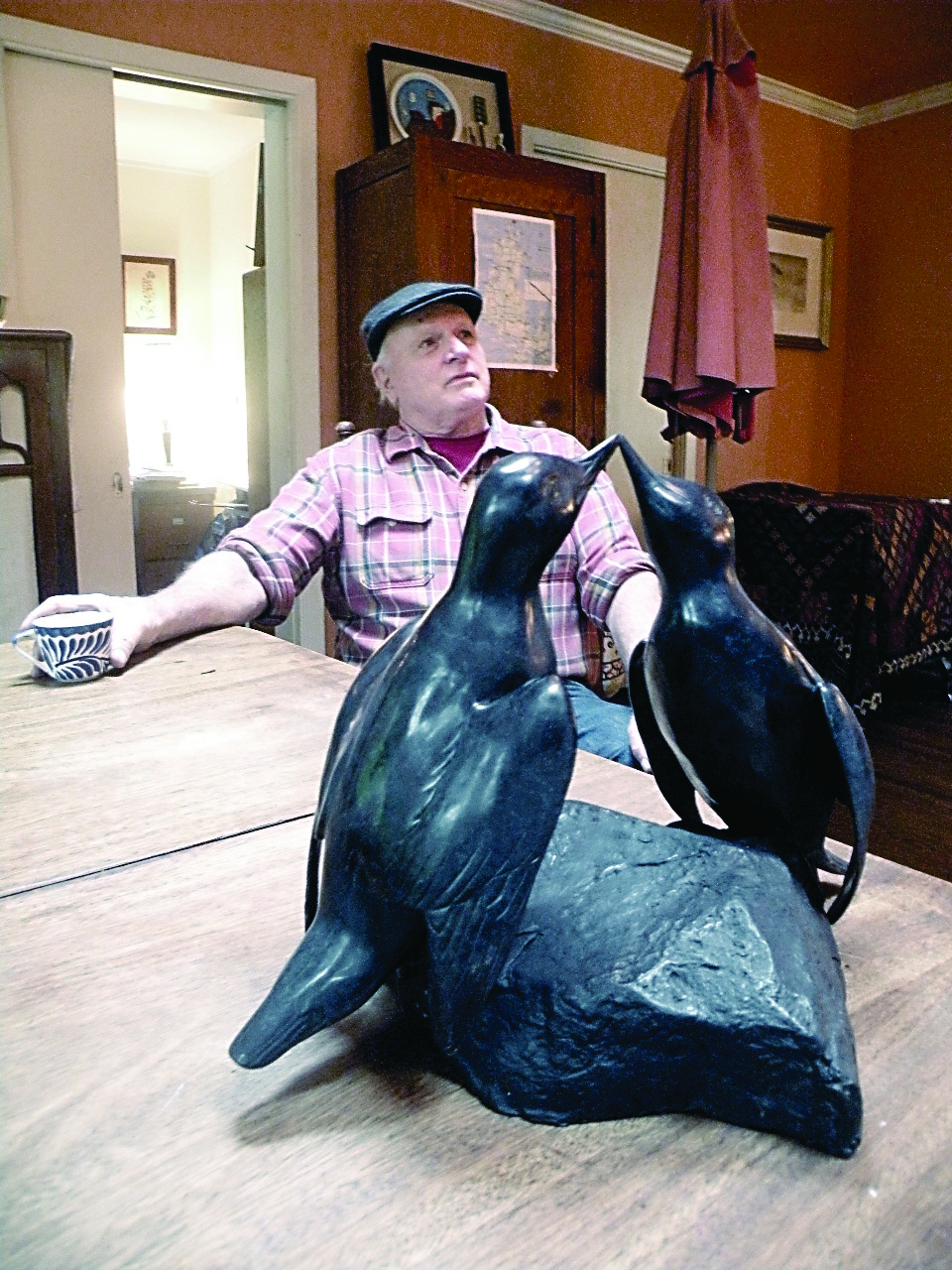 Seattle artist Tony Angell with “Courting Guillemots.” Angell created the sculpture