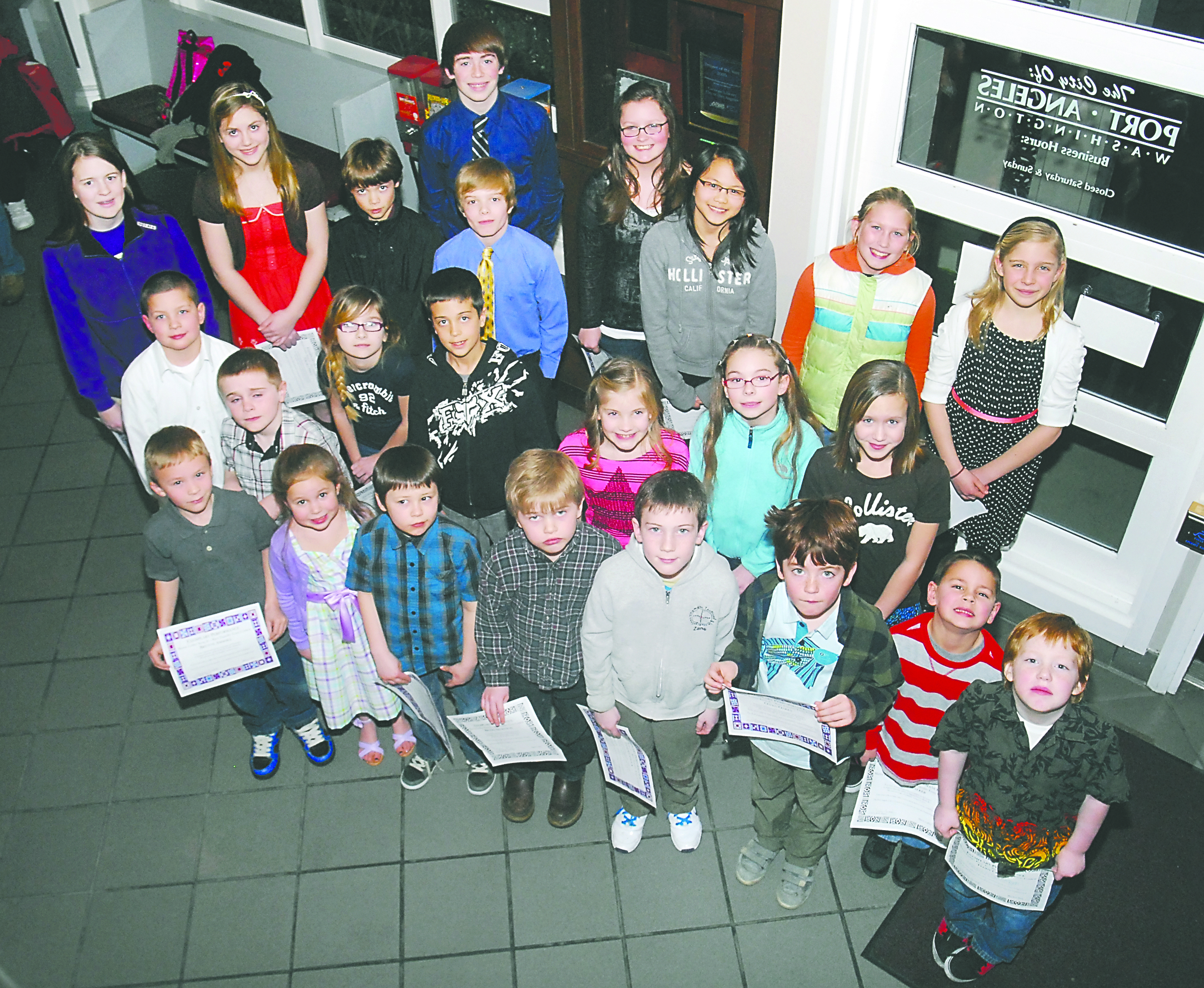 Winners of the 2013 Race Equality Essay Contest in the Port Angeles School District gather with their certificates in Port Angeles City Hall on Tuesday. The winners include