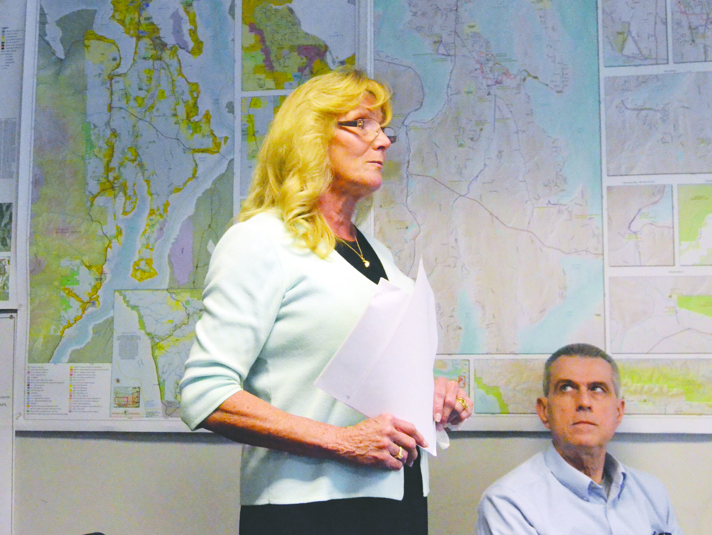 Jefferson County Auditor Donna Eldridge speaks out in support of a salary increase for Jefferson County commissioners at a meeting Monday as Tom Thiersch listens. — Charlie Bermant/Peninsula Daily News