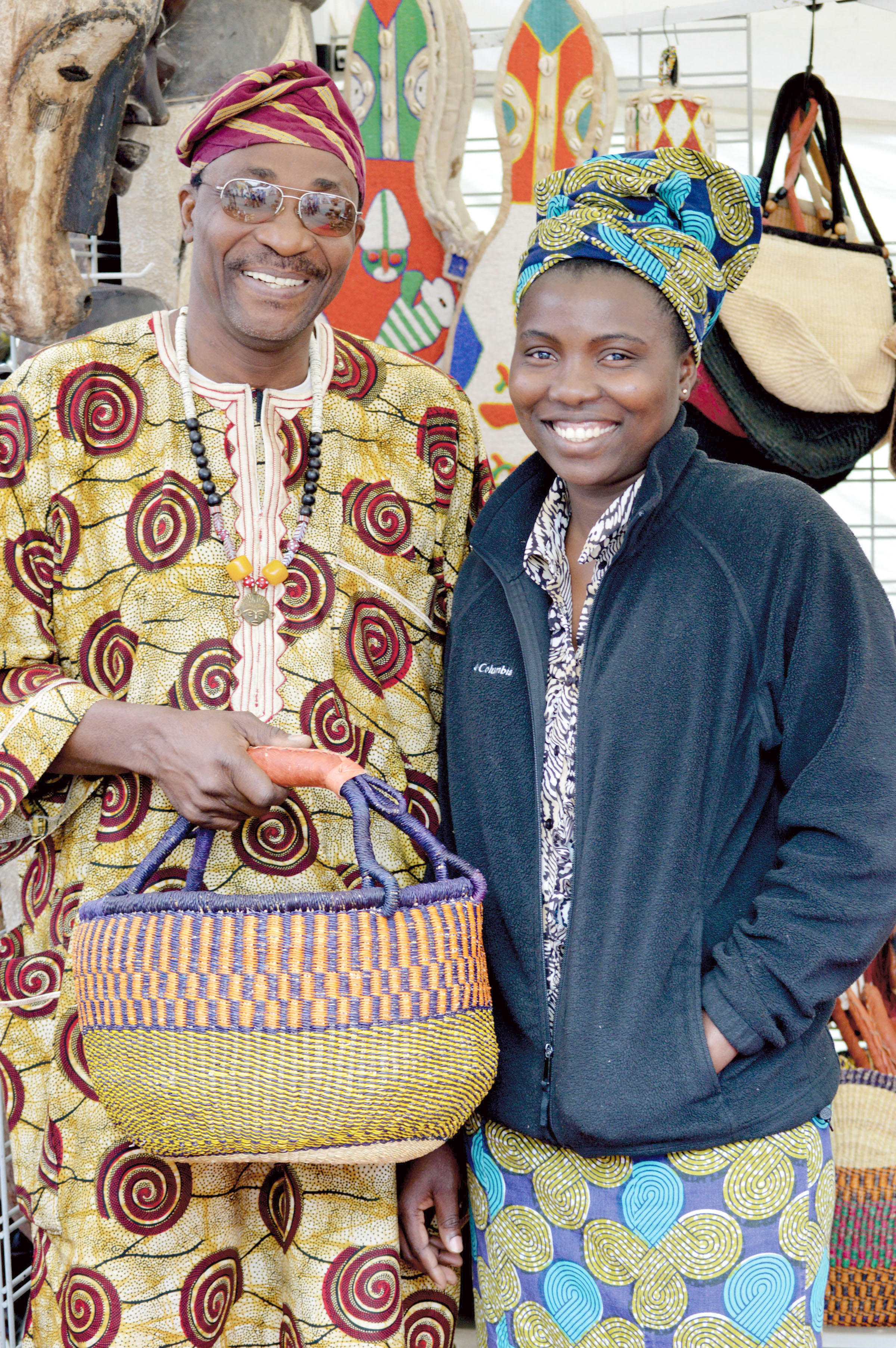 Vendors Ade and Priscilla Okunuga at the Juan de Fuca Festival of the Arts street fair. —Photo by Diane Urbani de la Paz/Peninsula Daily News